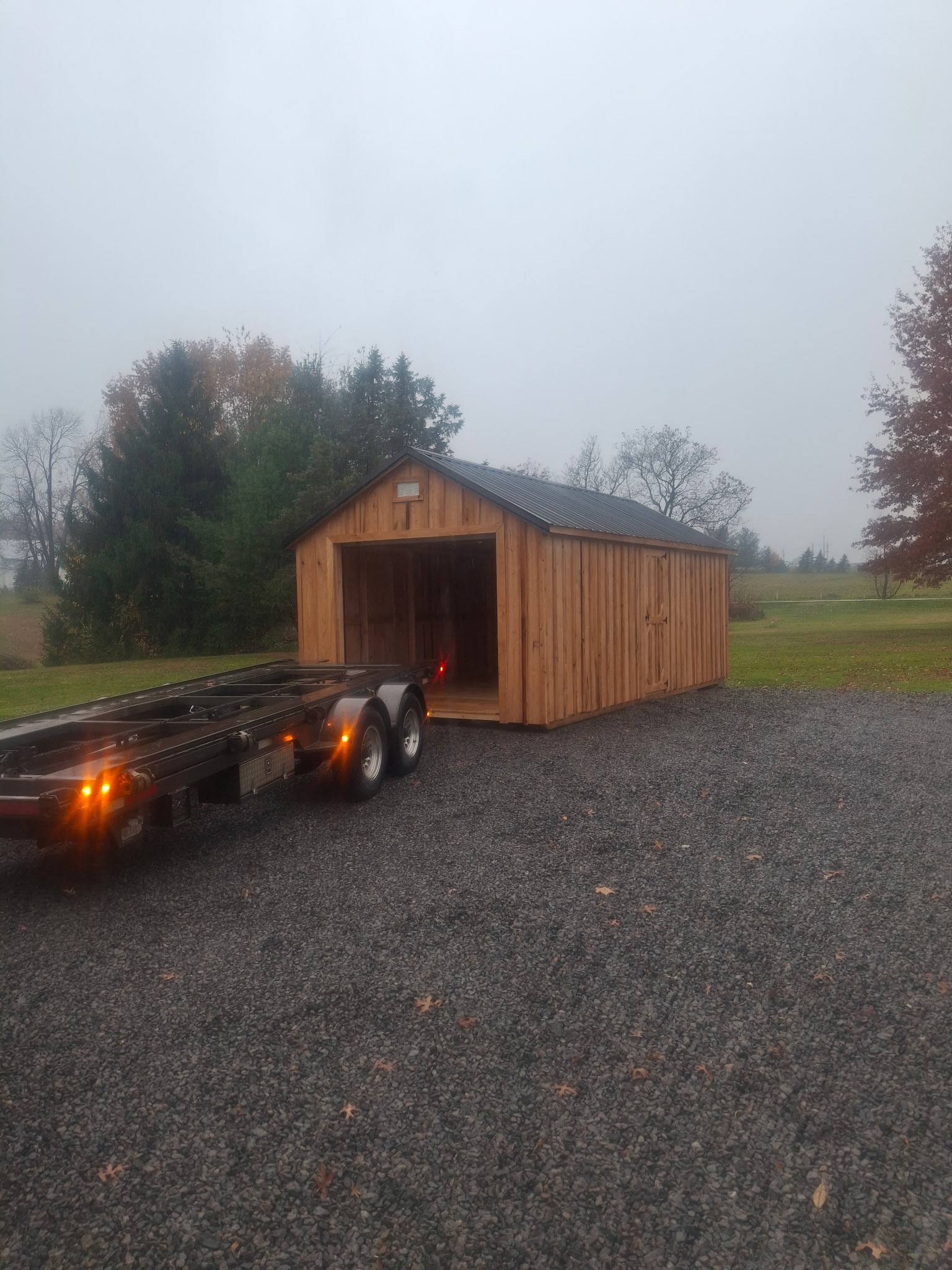 Wilmington natural wood shed with dark metal roof