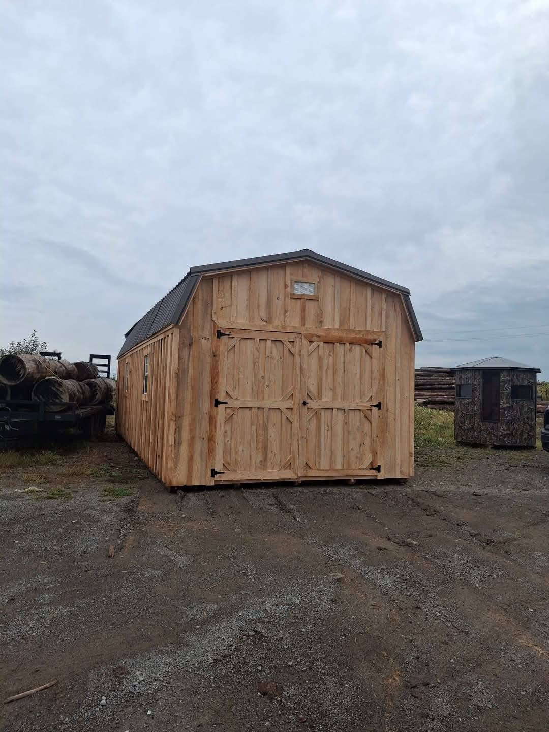 Wilmington natural wood shed with dark metal roof